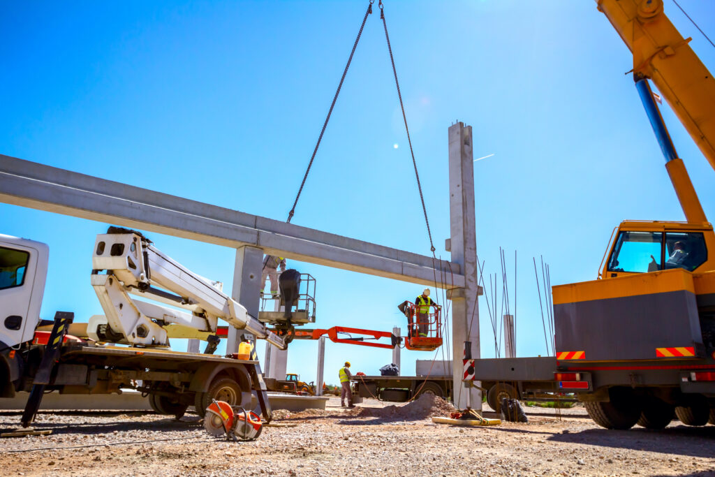 Worker is helping crane from cherry picker, keep balance and direction Crane moving service kenosha, photo of the site with sunshine